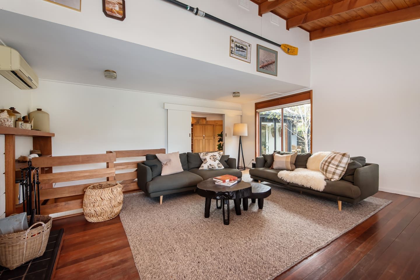 The living room with its open fire and grey sofas
