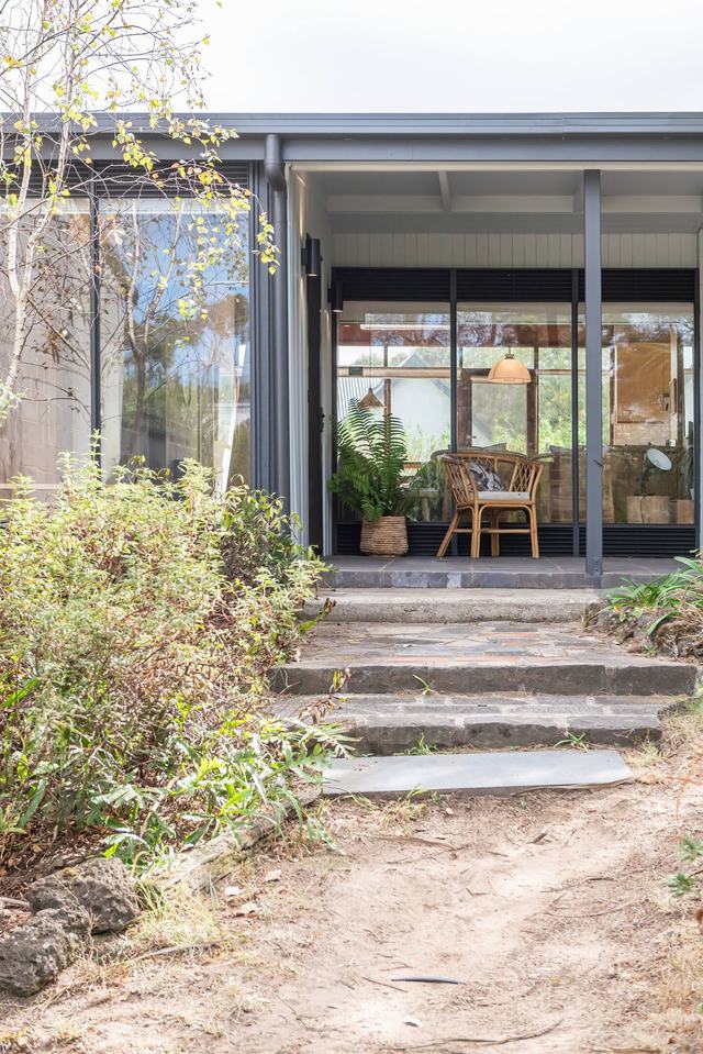 Stone steps leading up through the garden to the front porch